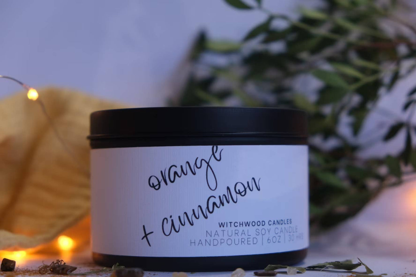 Cinnamon and Orange scented soy candle in matte black tin